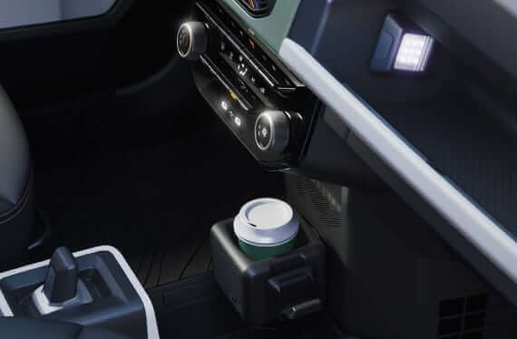Close up interior view of Dacia Spring buttons and cup holder