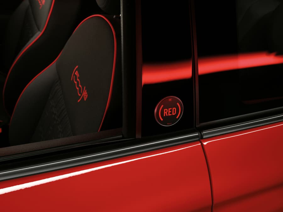 Red kit detailing on exterior and front seat