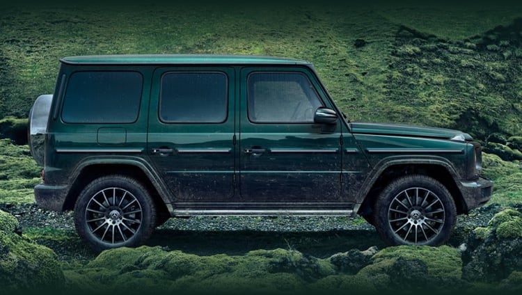 Green Mercedes-Benz G-Class model parked on gravel road