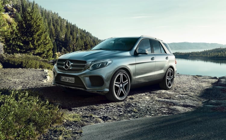 Silver Mercedes-Benz GLE model parked at lake