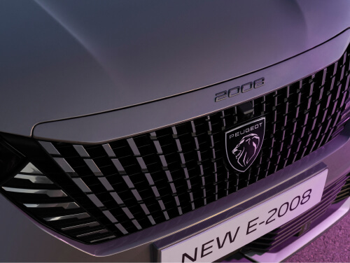 Close up view of Peugeot 2008 Grille, LED headlights and badge