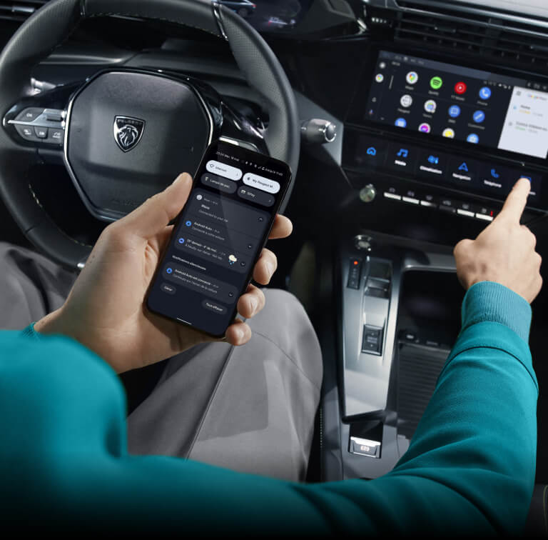 Interior of Peugeot 408, displaying phone technology and connectivity