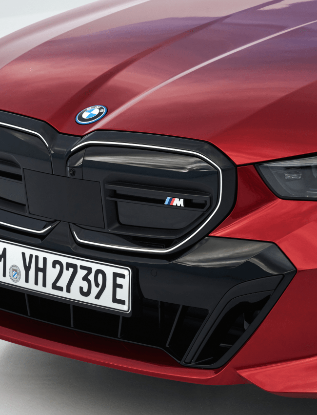 Close up view of red BMW i5 M60 grill