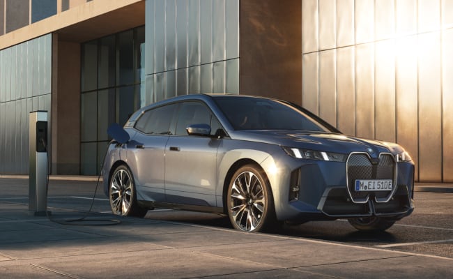 Front angled view of BMW iX charging