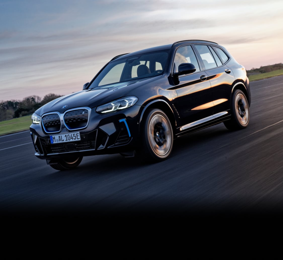 Front side view of BMW iX3 on the road