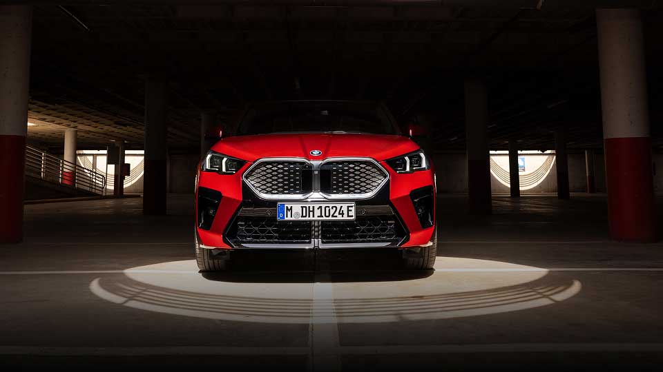 Front view of red BMW grille and bonnet