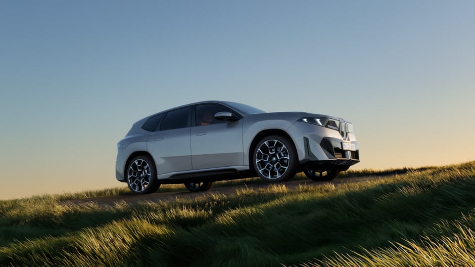 Side angled view of BMW on a hill