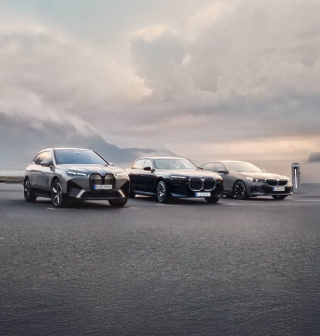 Front angled view of BMW vehicles and charger