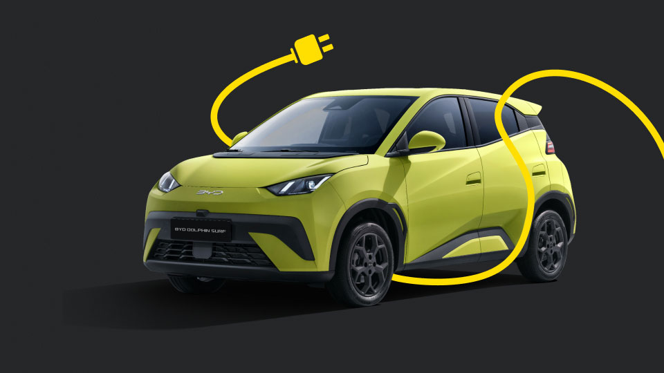 Image of yellow BYD Dolphin Surf entwined in an electric cable and plug