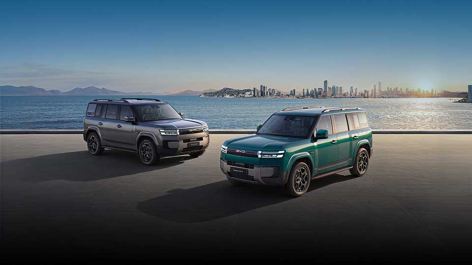Two BYD Ti 7 DM-p's parked on a city shoreline