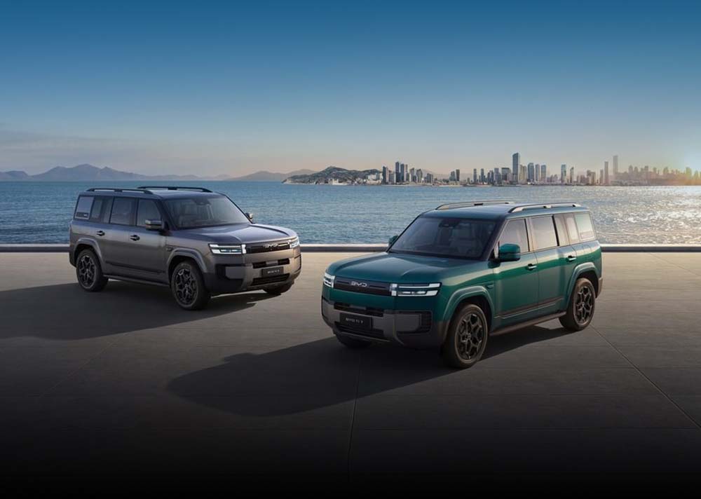 Two BYD Ti 7's on a city shore