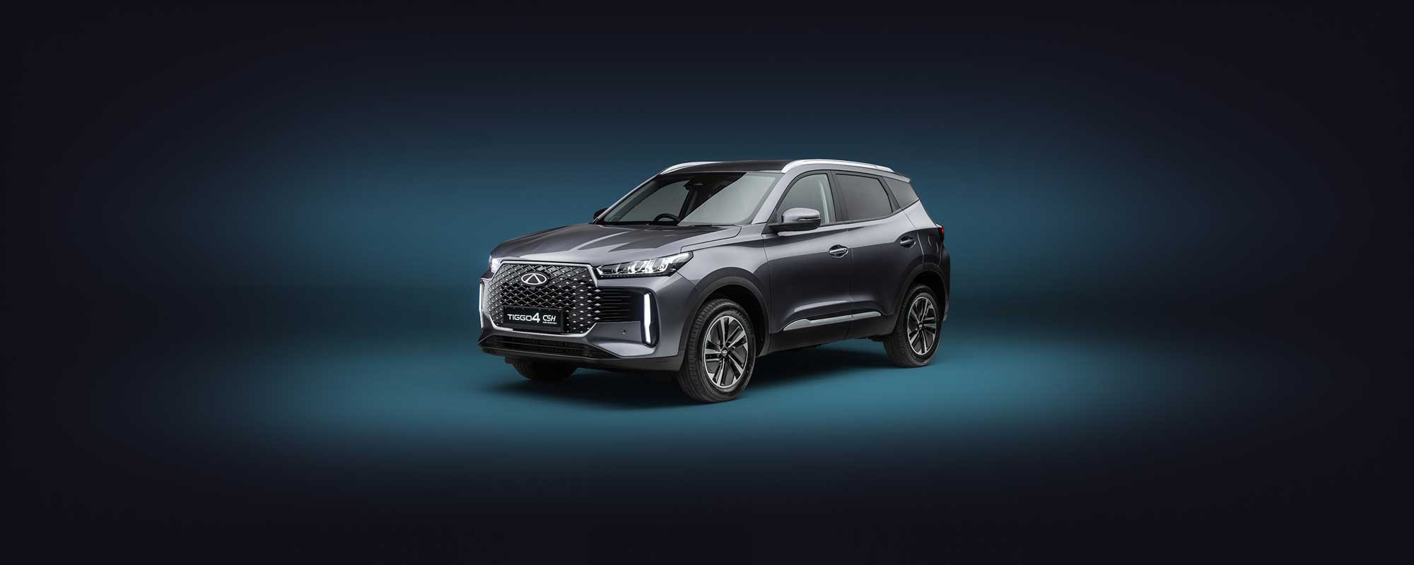 Chery Tiggo 4 in dark silver against a dark blue background