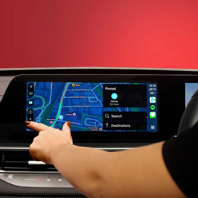 Woman operating Chery Tiggo 7 touchscreen