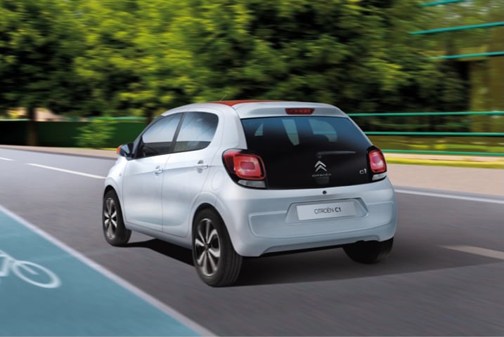 Rear view if a silver Citroen C1 driving on motorway