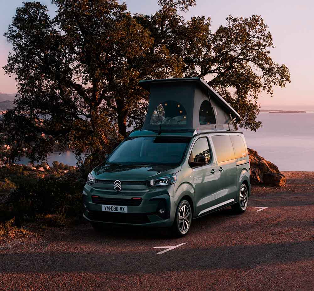 Front angled view of Citroën Holidays with sunset on a hill