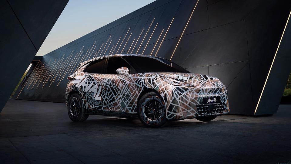 Front angled view of the Cupra Raval covered in camouflage paintwork