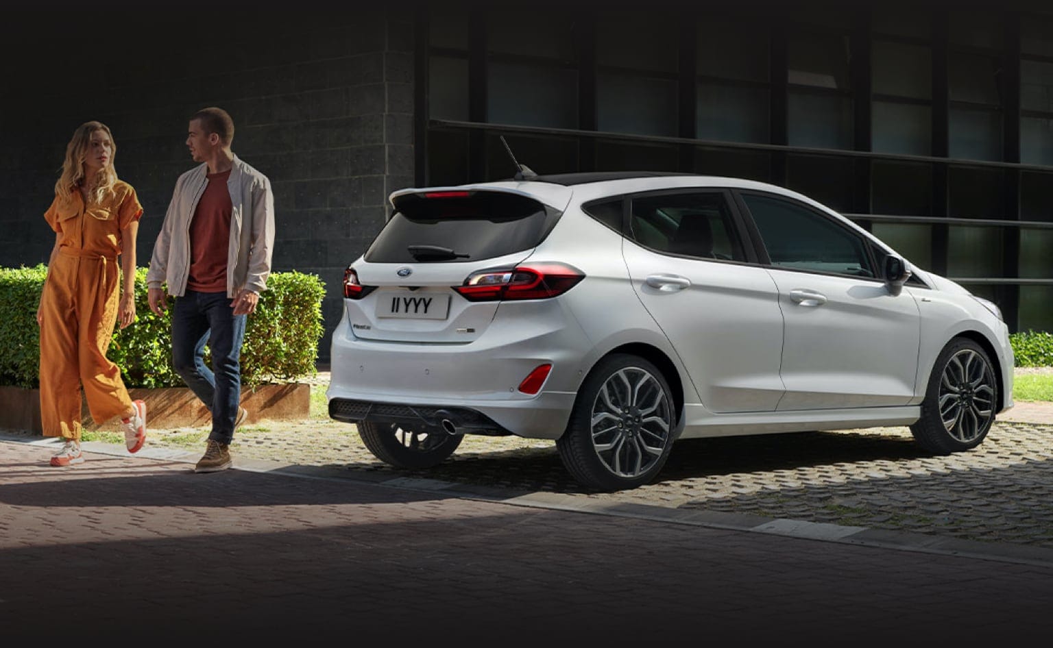 Angled rear shot of white Ford Fiesta