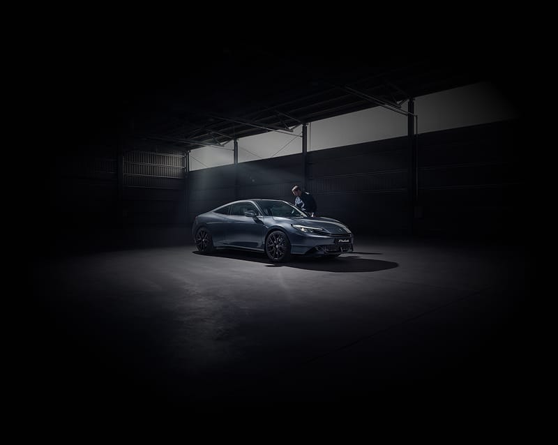 Honda Prelude in dark garage/shelter.