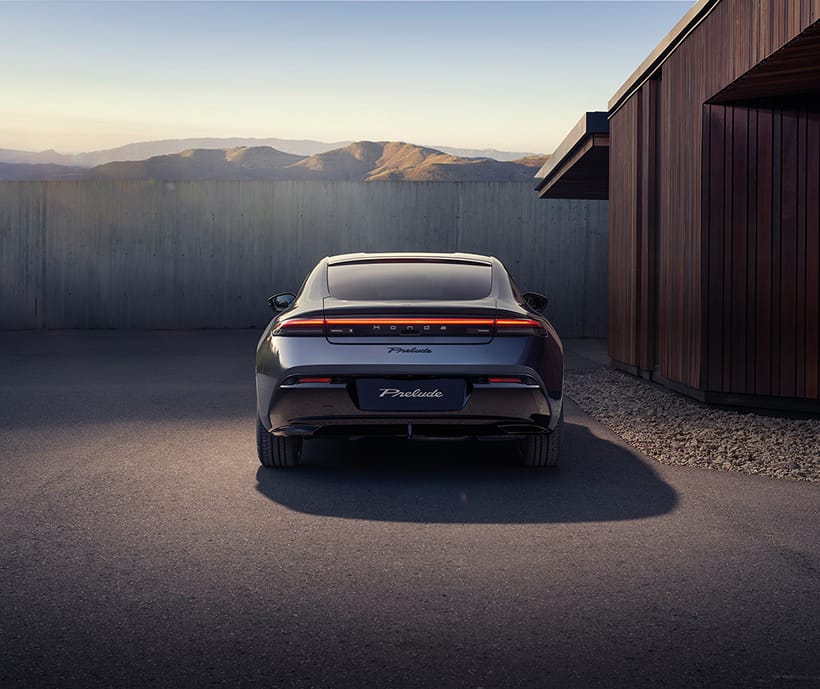 Rear view of Honda Prelude parked infront of house