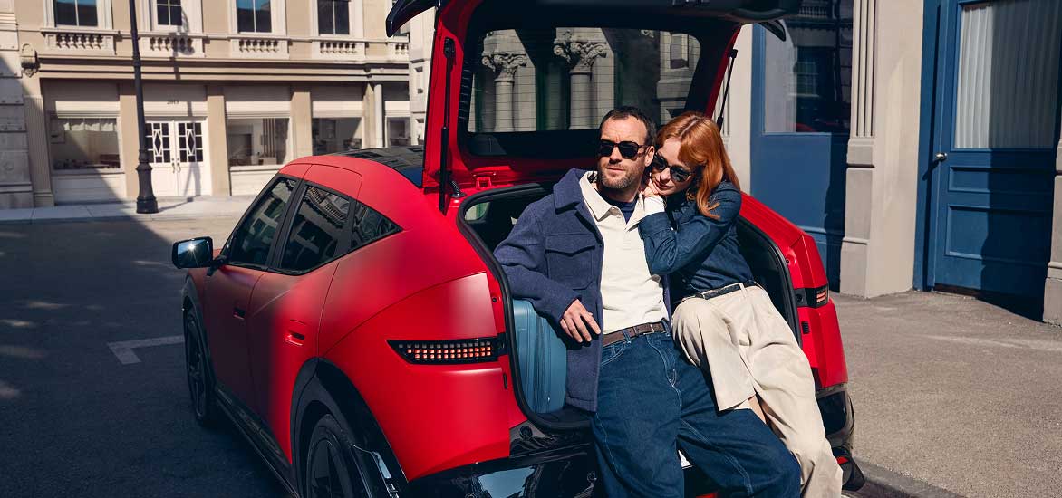 Couple sitting inside Hyundai IONIQ 3 boot