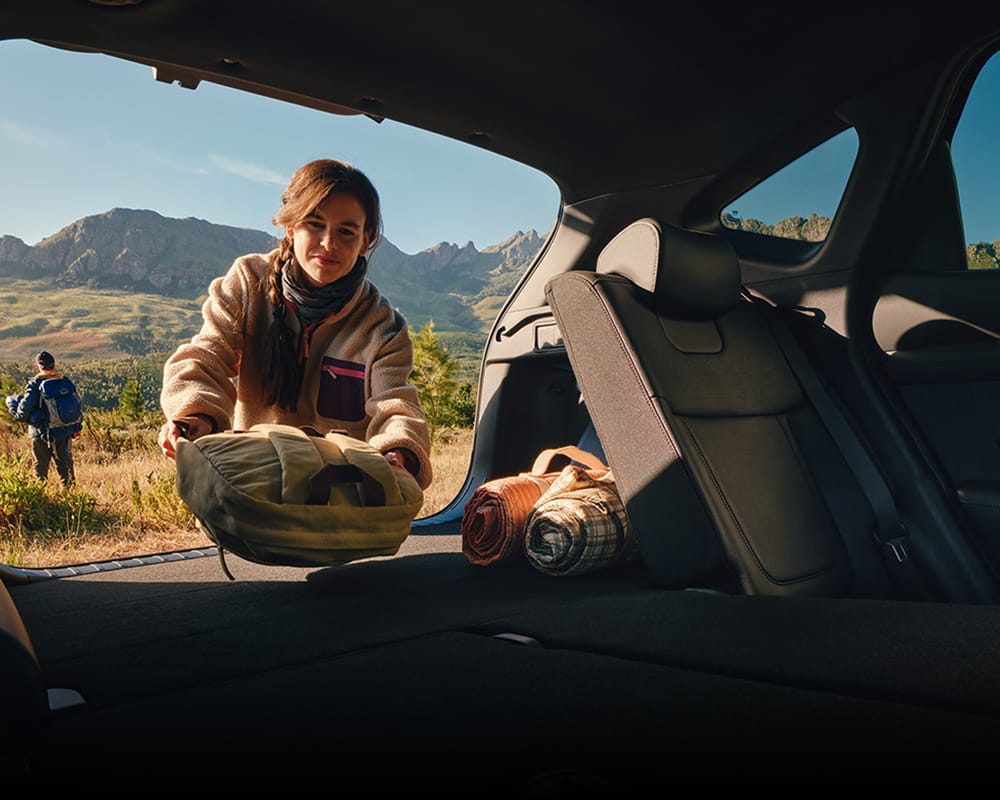 Woman loading items into back of Hyundai TUCSON