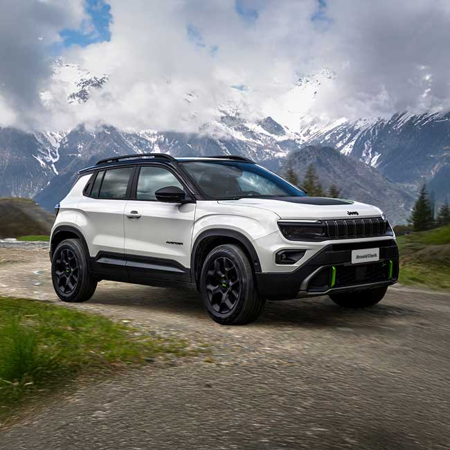 Angled front shot of white Jeep Avenger 4xe with mountains in background