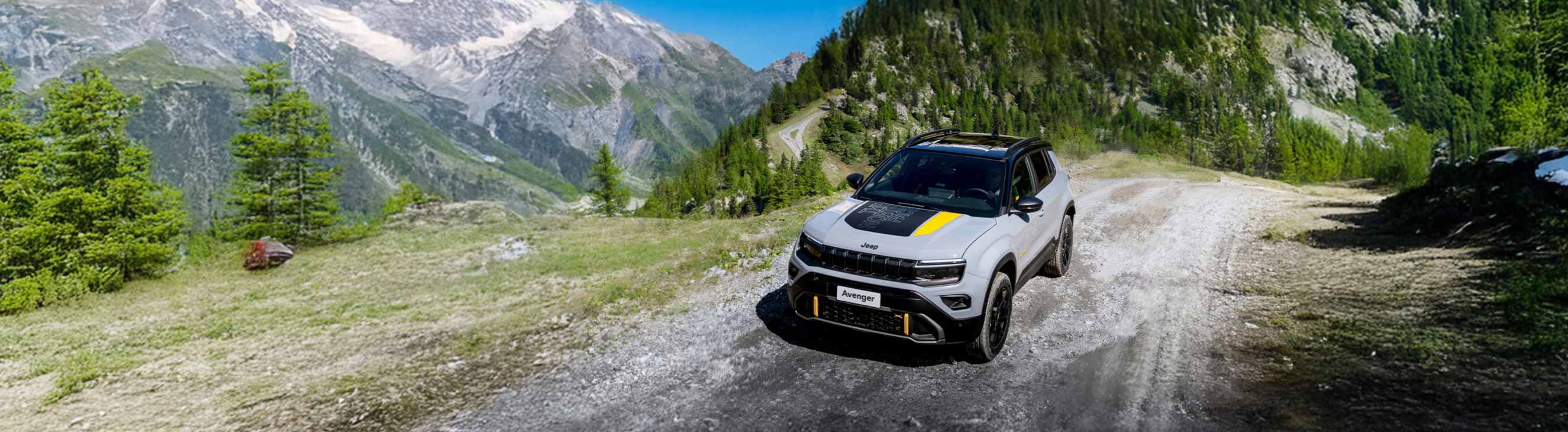 Jeep Avenger 4xe  driving on gravel mountain road