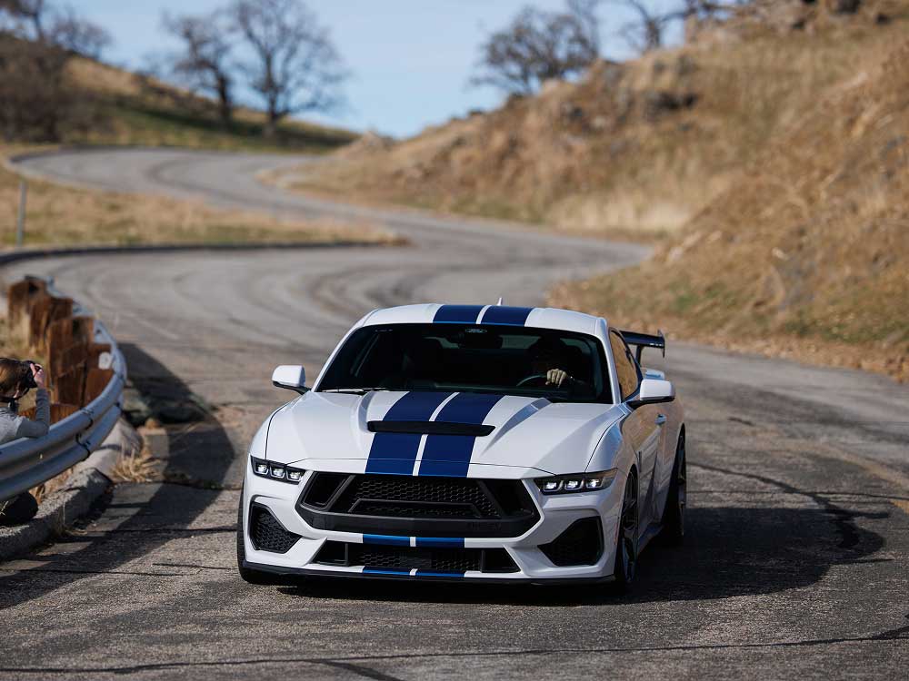 Mustang GT30 cornering on a twisty road