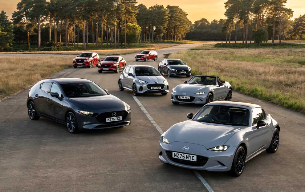 Image of the Mazda range of cars on a test track in a sunny late summer afternoon