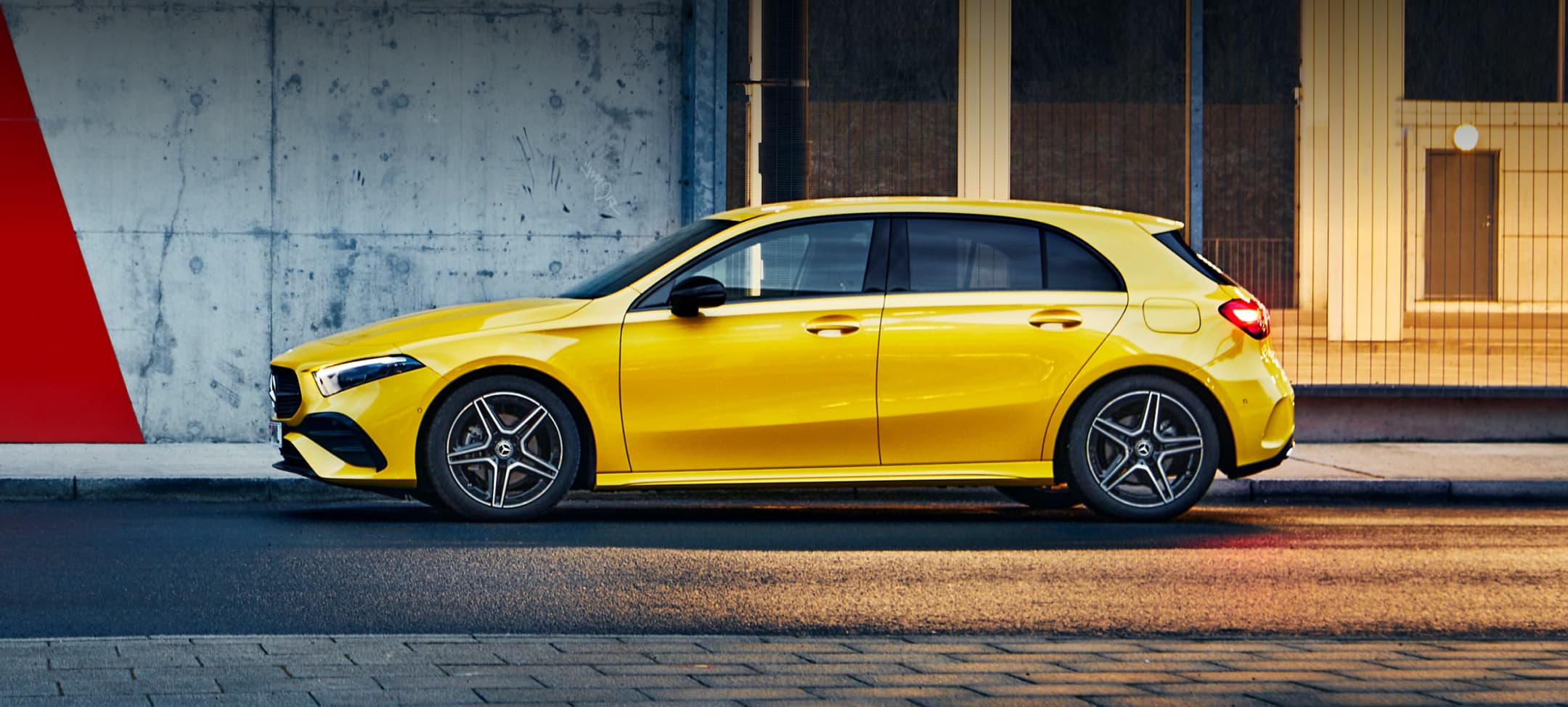 Rear Angled shot of yellow Mercedes-Benz A-Class Hatchback