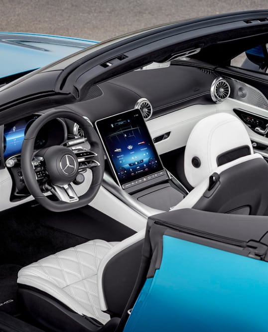 Side angled interior view of Mercedes AMG-SL steering wheel and display screen