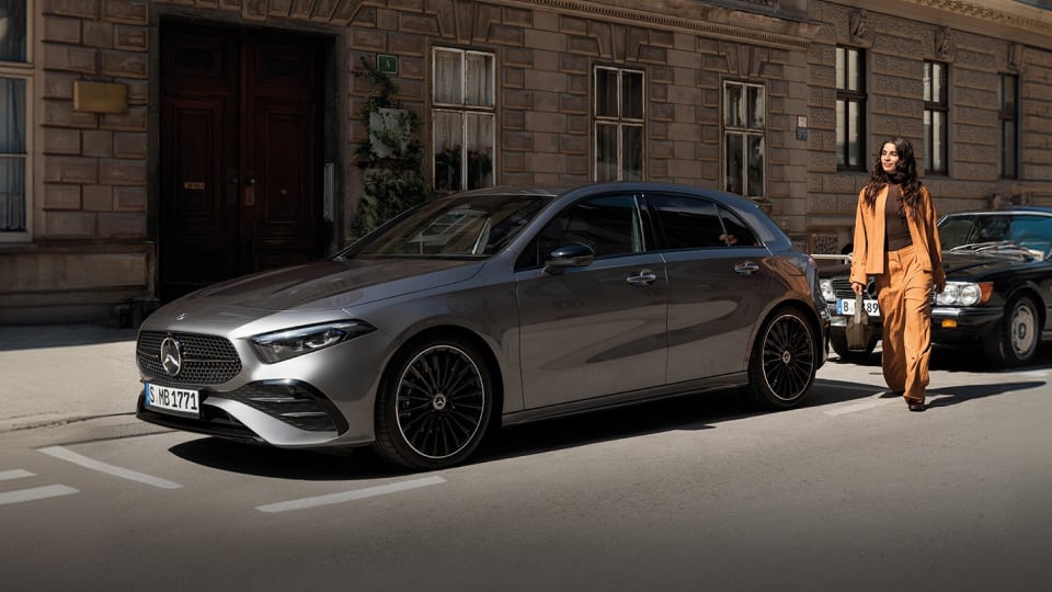 Front angled view of Mercedes-Benz vehicles on street with model