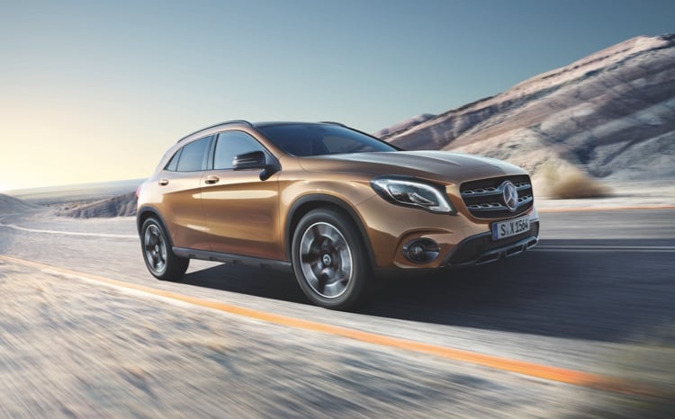 Mercedes-Benz GLA model driving through a country road