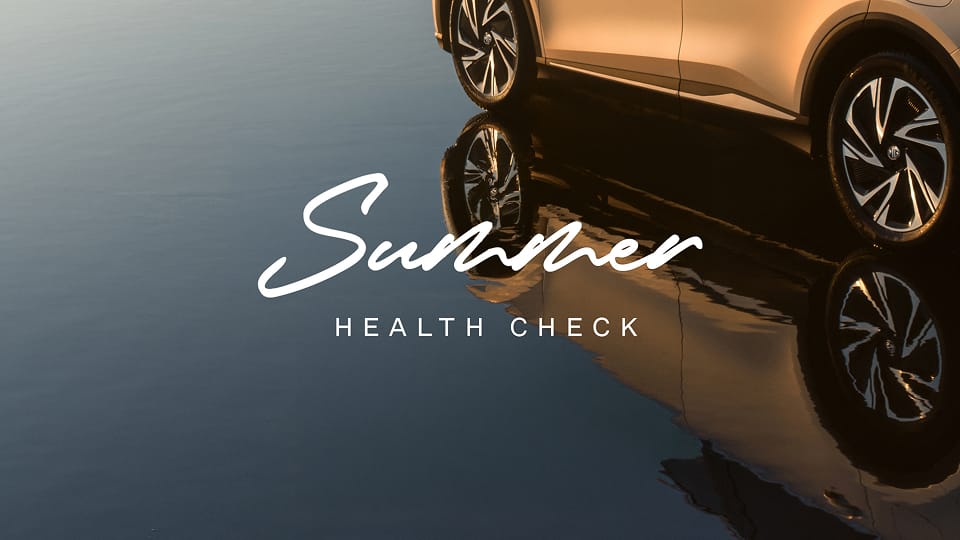 Image of MG SUV in water with reflection and Summer Health Check text