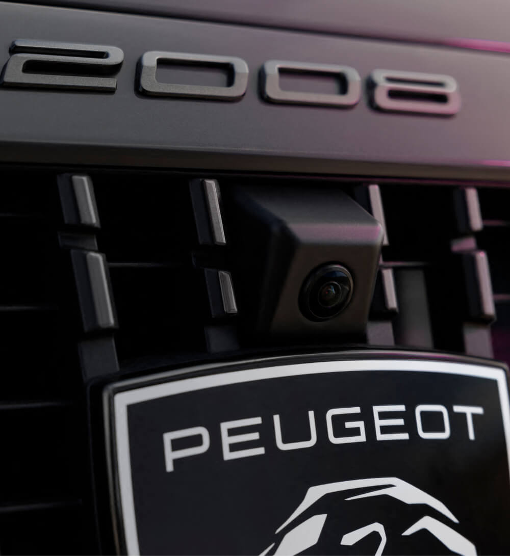 Close up view of Peugeot 2008 parking camera and badge logo