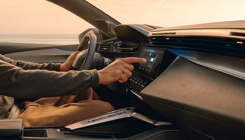 Interior view of Peugeot 408 with model using screen