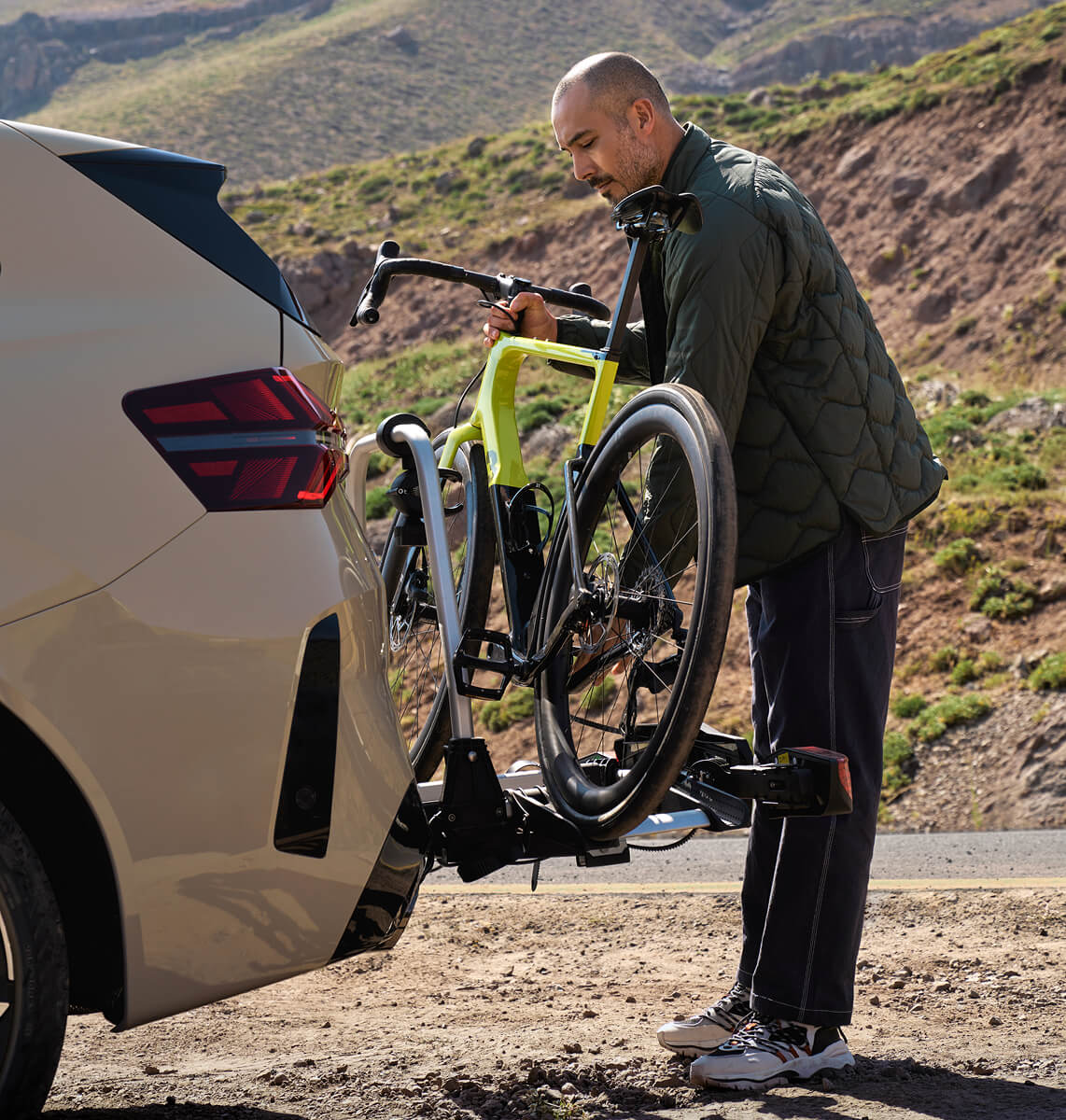 Person removing bike from car
