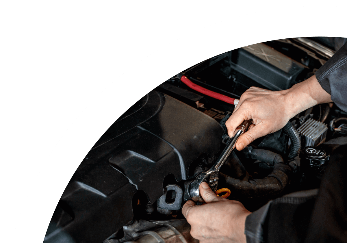 Mechanic working on vehicle engine