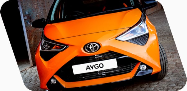 Front on view of a purple Toyota Aygo