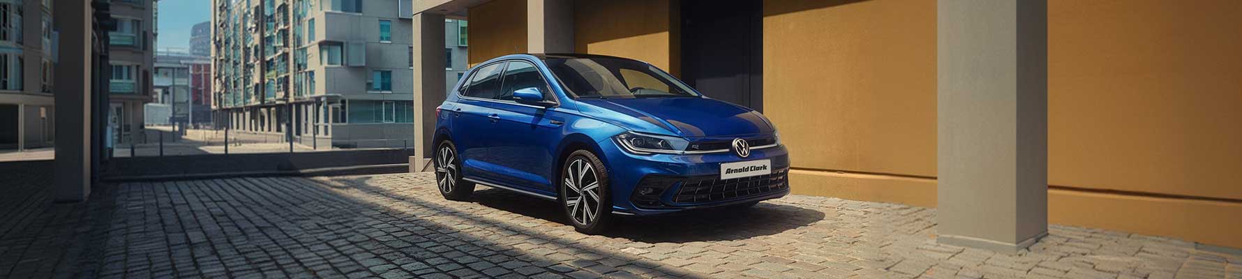 Blue Volkswagen Polo parked on a suburban street