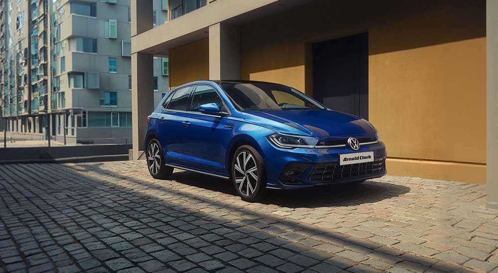 Blue Volkswagen Polo parked on a suburban street