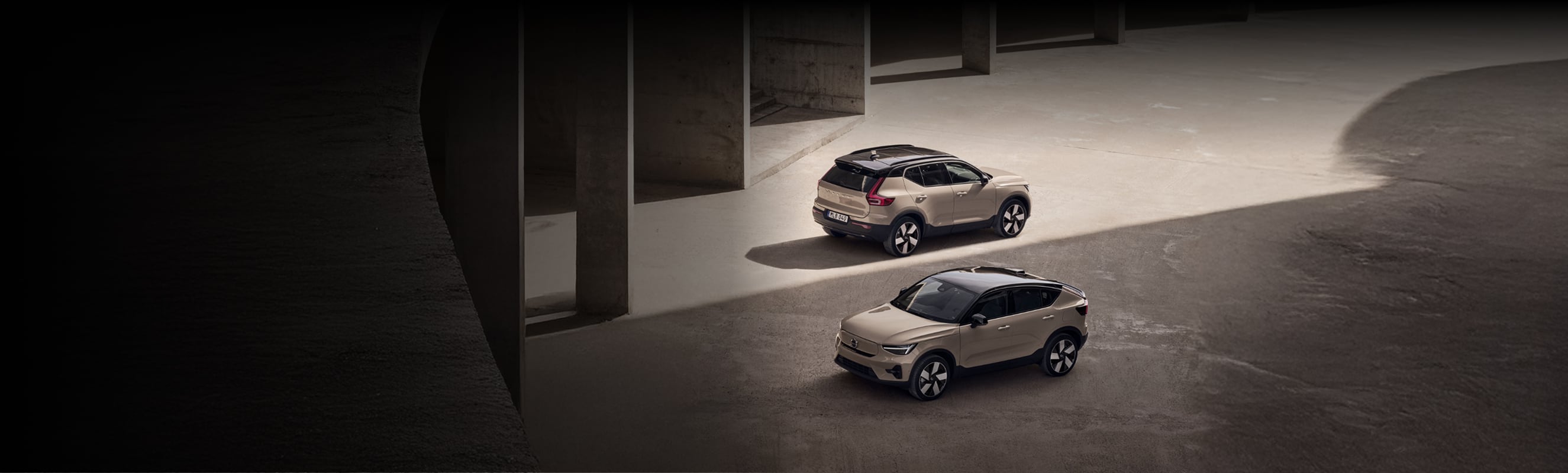 Upward angled view of two Volvo vehicles