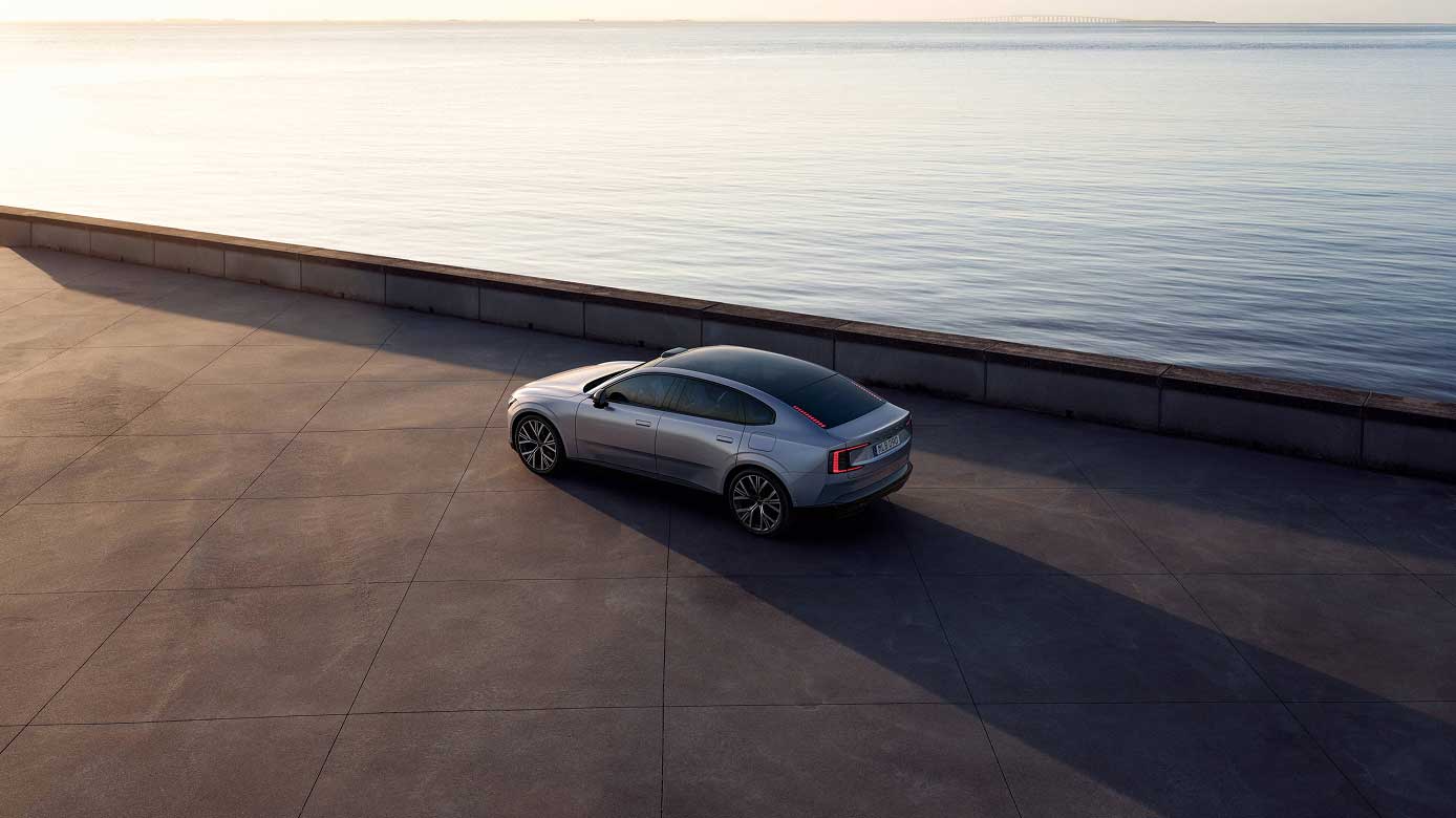 Volvo ES90 by the sea at sunset