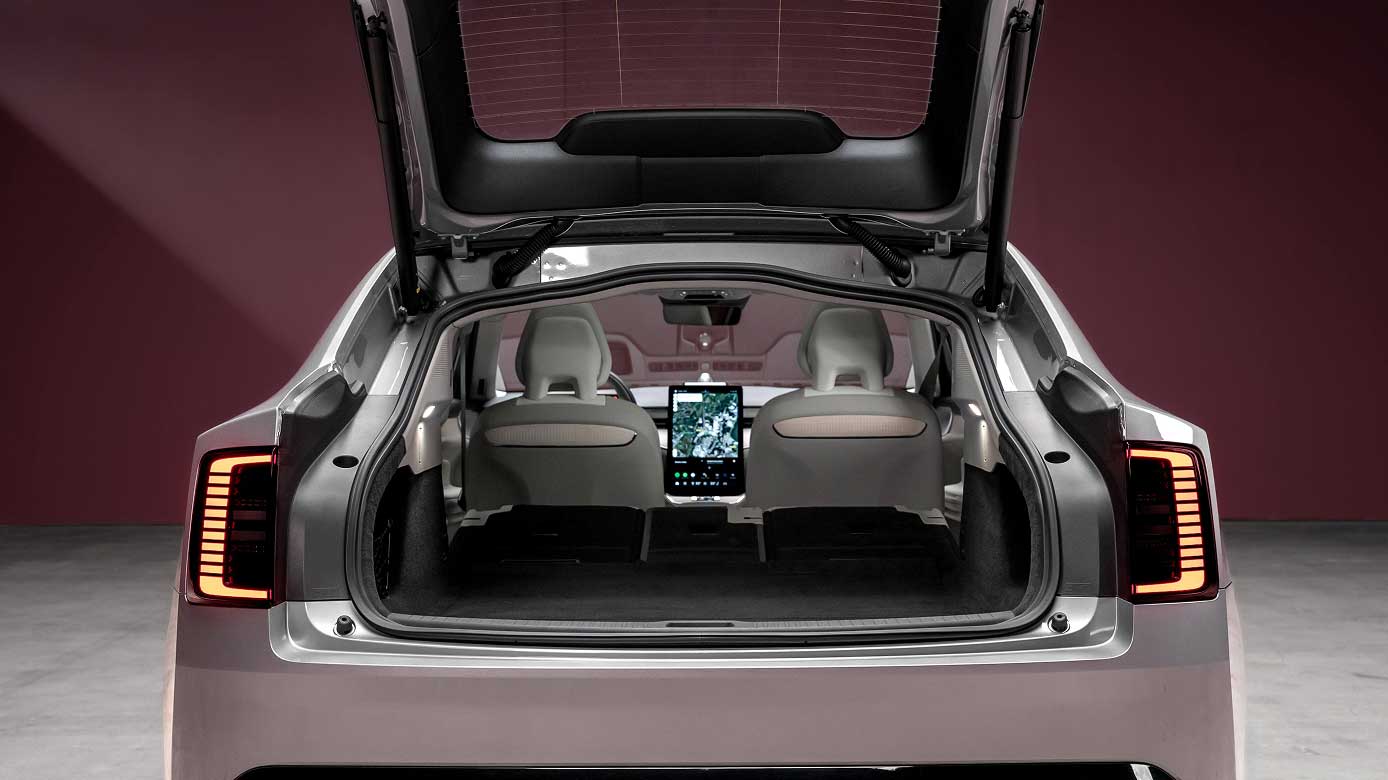 Volvo ES90 rear view with boot open showing interior and touchscreen